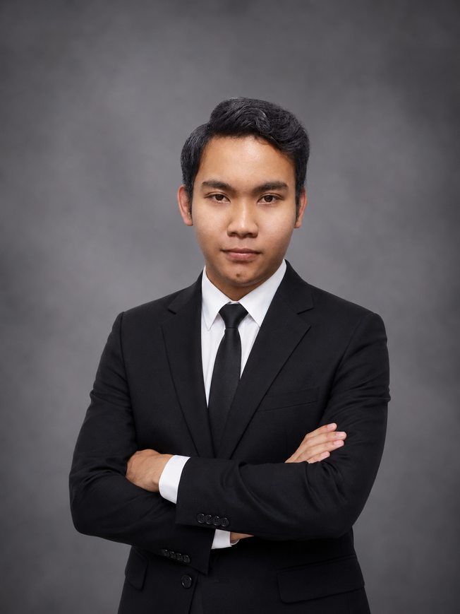 Dimas Adi Darmawan, arms crossed, studio portrait