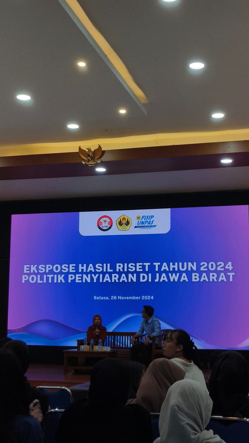 Seminar stage presenting KPID broadcasting research
